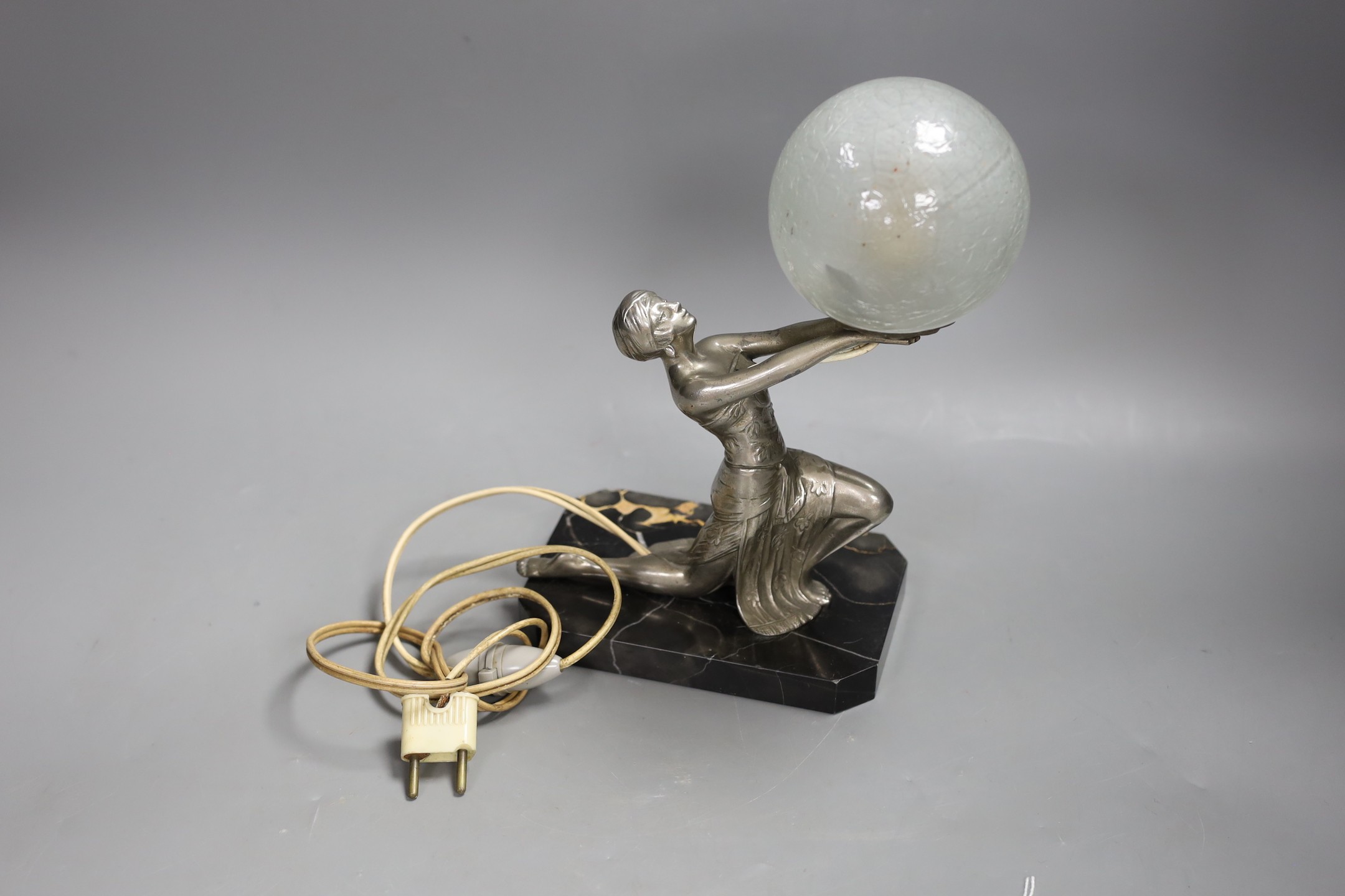 An Art Deco silvered metal figural lady lamp. 26cm high